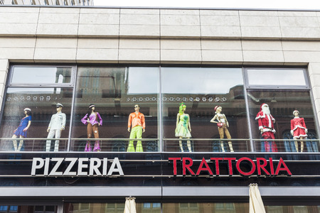 Berlin, Germany - April 14, 2017: Fancy dress shop over a pizzeria trattoria in Berlin, Germanyのeditorial素材