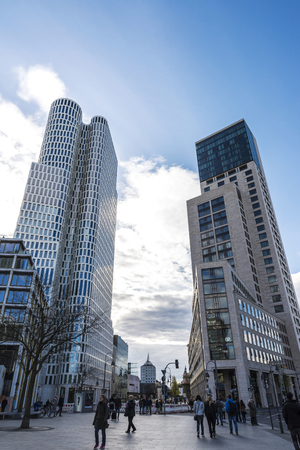 Berlin, Germany - April 14, 2017: Skyscraper and modern buildings with people walking in Breitscheidplatz. It is a major public square in the inner city of Berlin, Germanyのeditorial素材