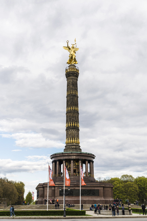 Berlin, Germany - April 14, 2017: People walking around the Victory Column (Siegessaule) in Berlin, Germany. It is a monument to commemorate the Prussian victory in the Danish-Prussian War in Berlin, Germany.のeditorial素材