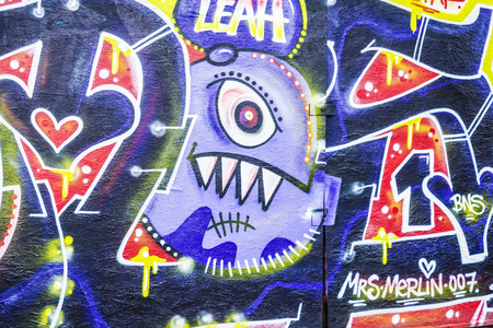 Berlin, Germany - April 13, 2017: Wall covered with multicolored graffiti in Berlin, Germanyのeditorial素材