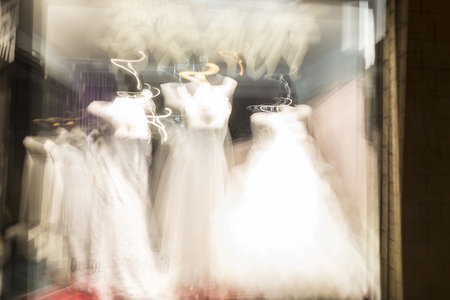 White wedding dresses at night on street as abstract backgroundの写真素材