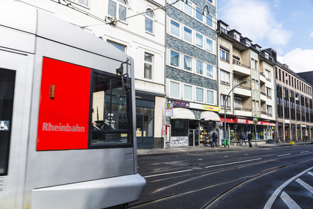 Dusseldorf, Germany - April 17, 2017: Tram circulating by a street and people walking in Dusseldorf, Germanyのeditorial素材