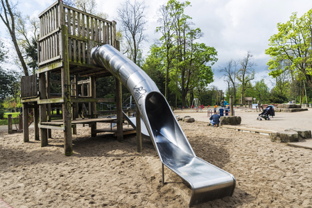 Dusseldorf, Germany - April 17, 2017: Toboggan in a park in autumn with people in Dusseldorf, Germanyのeditorial素材