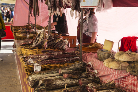 Cardona, Spain - October 30, 2016: Vendor in sausage and cheese store in the flea market of Cardona in Catalonia, Spainのeditorial素材