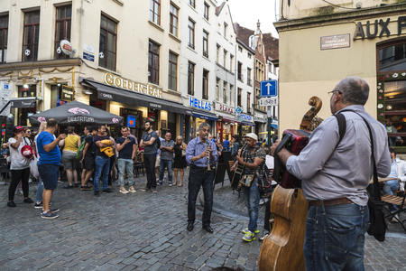 Brussels, Belgium - August 26, 2017: Band of street musicians and people walking on a street in Brussels, Belgiumのeditorial素材
