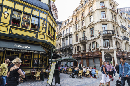 Brussels, Belgium - August 26, 2017: People in a bar having a drink and walking on a street in Brussels, Belgiumのeditorial素材