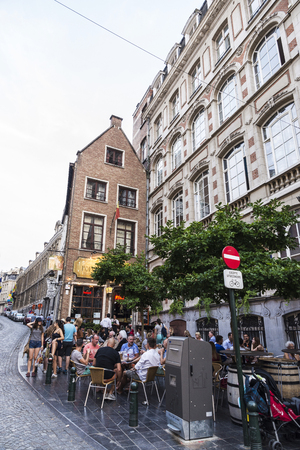 Brussels, Belgium - August 26, 2017: People in a bar having a drink and walking on a street in Brussels, Belgiumのeditorial素材