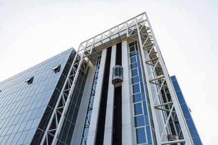 Facade of a modern office building with lift in Brussels, Belgium