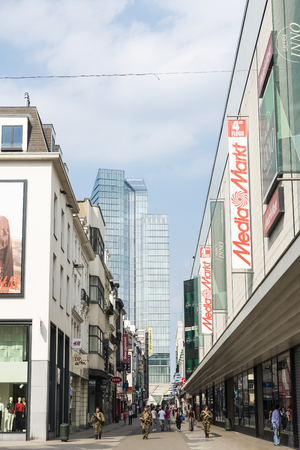 Brussels, Belgium - August 27, 2017: Three soldiers patrolling for terrorist threat on a shopping street in the center of Brussels, Belgiumのeditorial素材