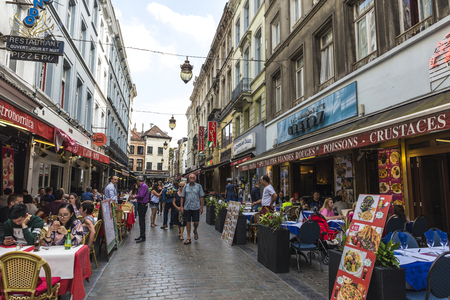 Brussels, Belgium - August 27, 2017: Street full of bars and restaurants with people walking located in the historic center of Brussels, Belgiumのeditorial素材