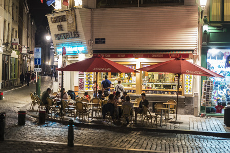 Brussels, Belgium - August 27, 2017: Street with a bar or restaurant  with people at night located in the historic center of Brussels, Belgiumのeditorial素材