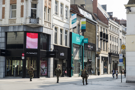 Brussels, Belgium - August 27, 2017: Three soldiers patrolling for terrorist threat on a shopping street in the center of Brussels, Belgiumのeditorial素材