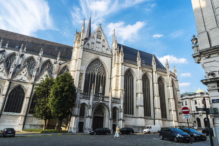 Brussels, Belgium - August 27, 2017: Facade of the Cathedral of Brussels or Cathedral of St. Michael and St. Gudula with a woman walking in Brussels, Belgiumのeditorial素材