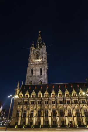 Belfry of Ghent, bell tower, next to the Cloth Hall at night in the medieval city of Ghent, Belgiumの写真素材