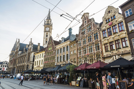 Ghent, Belgium - August 28, 2017: People in a bar having a drink and walking on a street in the old town of the medieval village of Ghent, Belgiumのeditorial素材