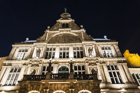 Facade of an old historic buildings at night of the medieval city of Ghent, Belgiumの写真素材