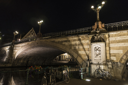 Bridge of Saint Michael at night with parked bicycles in the medieval city of Ghent, Belgiumの写真素材