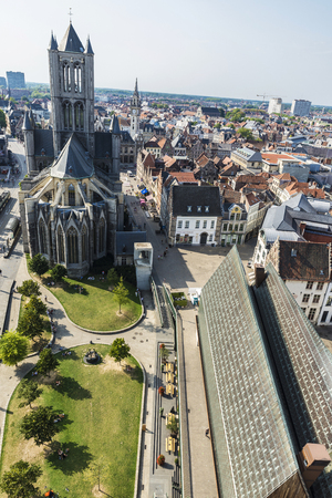 Ghent, Belgium - August 29, 2017: View of the Saint Nicholas Church and Stadshal with people walking in the old town of the medieval city of Ghent, Belgiumのeditorial素材