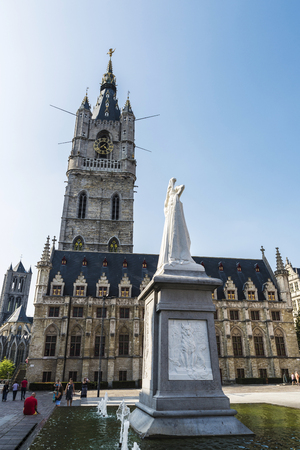 Ghent, Belgium - August 29, 2017: Belfry of Ghent, bell tower, next to the Cloth Hall with people walking in the medieval city of Ghent, Belgiumのeditorial素材