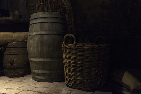 Groceries in baskets and barrels in a medieval warehouse in Europeの写真素材