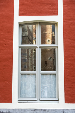 Window of an old classic building in an old historic center of the medieval city of Ghent, Belgiumの写真素材