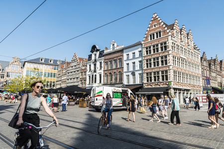 Ghent, Belgium - August 29, 2017: Women on bicycles circulating and people walking in an old historic center of the medieval city of Ghent, Belgiumのeditorial素材
