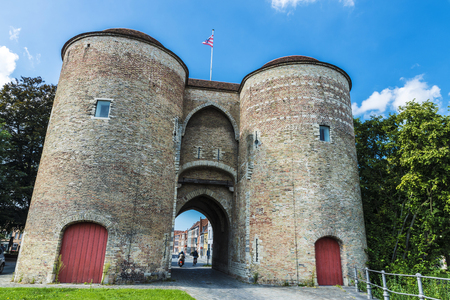 Gentpoort (Gate of Ghent) in the medieval city of Bruges, Belgiumの写真素材