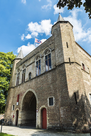Gentpoort (Gate of Ghent) in the medieval city of Bruges, Belgiumの写真素材