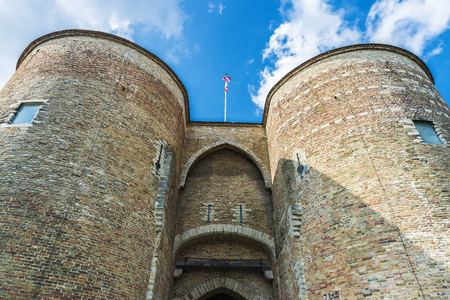 Gentpoort (Gate of Ghent) in the medieval city of Bruges, Belgiumの写真素材