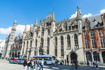 Bruges, Belgium, - August 31, 2017: The Provinciaal Hof (Province Court), on the market place of Bruges with people around in Belgiumのeditorial素材