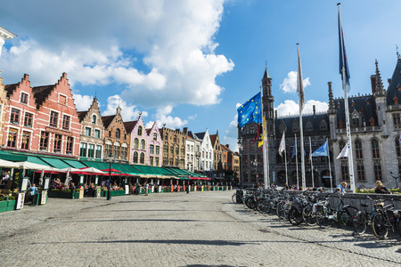 Bruges, Belgium, - August 31, 2017: Old colorful traditional houses in the Grote Markt ("Market Square") with people around in the historic center of the medieval city of Bruges, Belgiumのeditorial素材