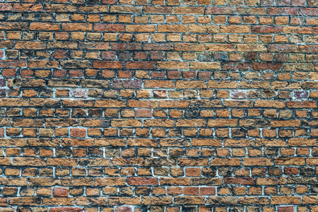 Wall of old bricks as background in Bruges, Belgiumの写真素材