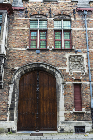 Facade of old historic building in the medieval city of Bruges, Belgiumの写真素材