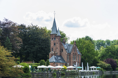 Bruges, Belgium - September 1, 2017: Old majestic mansion with its garden and terrace along the river in the medieval city of Bruges, Belgiumのeditorial素材