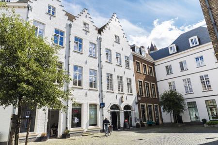 Bruges, Belgium - September 1, 2017: Facade of old historic buildings with people around in the medieval city of Bruges, Belgiumのeditorial素材