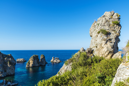 Cliffs on the coast in summer in Scopello near of Castellammare del Golfo in Sicily, Italy の写真素材