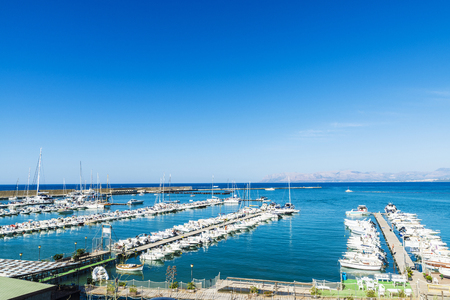Castellammare del Golfo, Italy - August 7, 2017: Yachts, boats and sailboats docked at the marina in summer in Castellammare del Golfo in Sicily, Italyのeditorial素材