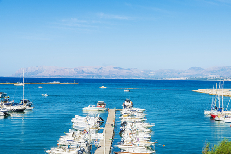 Castellammare del Golfo, Italy - August 7, 2017: Yachts, boats and sailboats docked at the marina in summer in Castellammare del Golfo in Sicily, Italyのeditorial素材