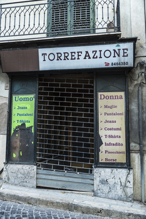 Corleone, Italy - August 9, 2017: Old abandoned shop in the old town of Corleone, a town known for associating with the mafia in Sicily, Italyのeditorial素材