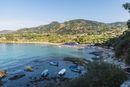Panoramic of a beach full of bathers in summer in Cefalu in Sicily, Italyの写真素材