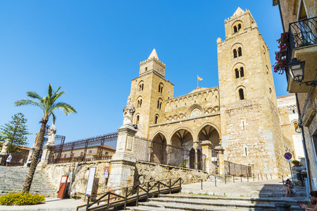 Cefalu, Italy - August 8, 2017: Facade of the cathedral of Cefalu, of style called Sicilian Romanesque, with people around in Sicily, Italyのeditorial素材
