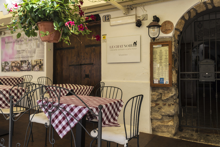 Cefalu, Italy - August 8, 2017: Terrace of a bar restaurant on a street of the old town of the historic village of Cefalu in Sicily, Italyのeditorial素材