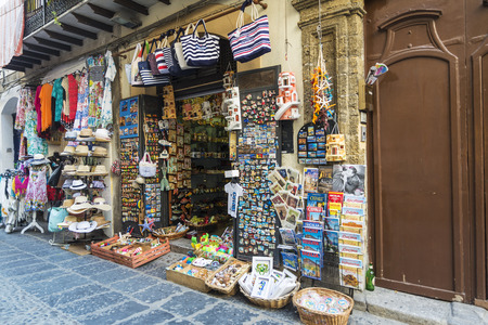 Cefalu, Italy - August 8, 2017: Souvenir shop in the old town of the historic village of Cefalu in Sicily, Italyのeditorial素材