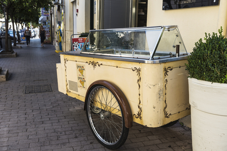 Cefalu, Italy - August 8, 2017: Old vintage ice cream cart on a street in the old town of the historic village of Cefalu in Sicily, Italyのeditorial素材