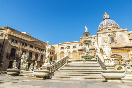 The Praetorian Fountain (Fontana Pretoria) with the dome of Santa Caterina in the background is a monumental fountain that represents the Twelve Olympians, other mythological figures, animals and the rivers of Palermo located in the old town of Palermo in Sicily, Italyの写真素材