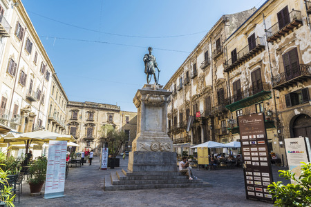 Palermo, Italy - August 10, 2017: Monument to Carlo V with bar and restaurants and people around in the old town of Palermo in Sicily, Italyのeditorial素材