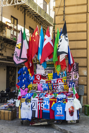 Palermo, Italy - August 10, 2017: Souvenir shop with flags and shirts of soccer teams on a flea market on a street in the old town of Palermo in Sicily, Italyのeditorial素材