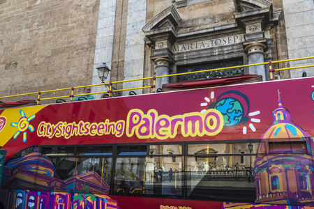 Palermo, Italy - August 10, 2017: Tour bus with tourists circulating on a street  in the old town of Palermo in Sicily, Italyのeditorial素材