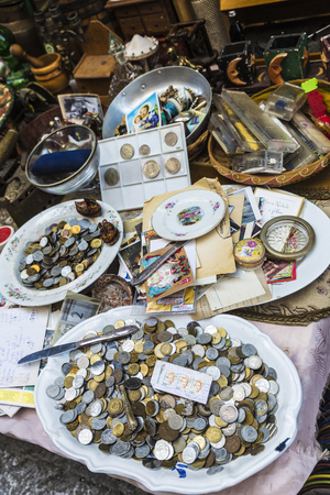 Palermo, Italy - August 10, 2017: Coins in an antique stand on a flea market on a street in the old town of Palermo in Sicily, Italyのeditorial素材
