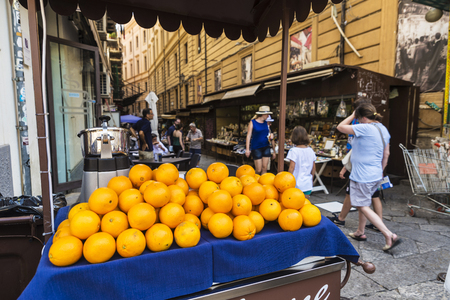 Palermo, Italy - August 10, 2017: Orange juice stand on a flea market on a street with people walking in the old town of Palermo in Sicily, Italyのeditorial素材